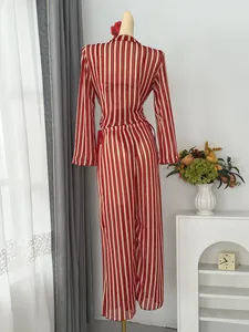 Back view of a chic red and white striped crochet beach cover-up set shown on a mannequin