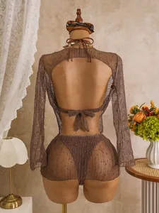 Exquisite detailed back view of a brown sequined mesh long sleeve cover-up and bikini set