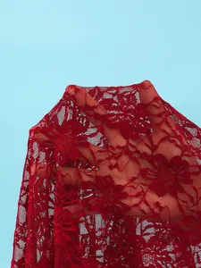 Detailed close-up of red floral lace mesh fabric showing semi-transparent texture