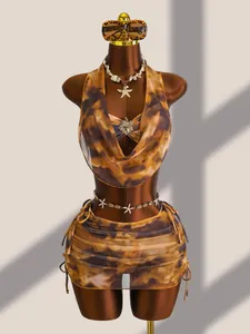 Maillard 4-delige bikiniset met transparante rok en zeester sieraden op mannequin