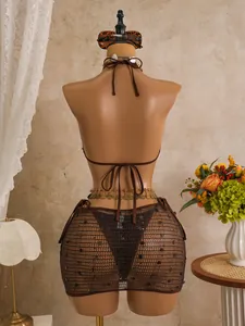 Vista posteriore del bikini vintage marrone 3 pezzi con gonna in rete con paillette
