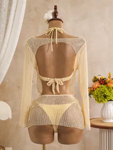 Detailed back view of a sequined long sleeve mesh three-piece bikini set in pale yellow.