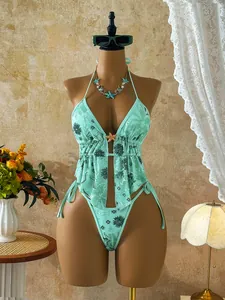 Mint green bikini set with sequined floral patterns and starfish detail for beach vacation