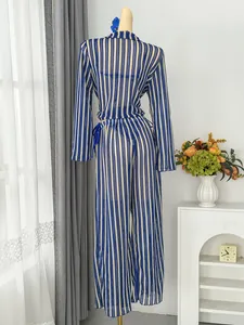 Back view of blue and white striped long sleeve cover-up top and wide-leg beach pants