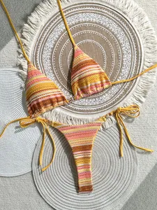 Close-up view of a multicolored striped crochet bikini set with vibrant summer tones.