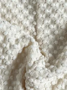 Macro view of white Swiss dot textured fabric detail for cross-border bikini swimwear