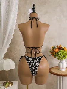 Back view of a sexy black bikini set featuring a decorative starfish waist chain on mannequin