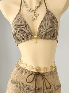 Close-up of three-piece leaf pattern crochet bikini set with matching trousers