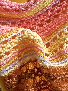 Close-up detail of multi-color striped crochet knit fabric for beach holiday bikini