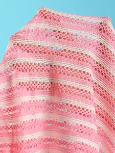 Close-up detail of pink and white striped crochet knit fabric for beachwear bikini