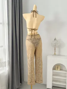 Detailed back view of the three-piece swimsuit set featuring leaf pattern mesh pants.