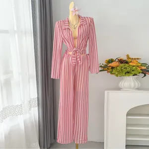 Pink and white striped 4-piece beachwear set with long sleeves and wide-leg pants