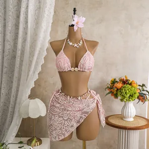 Sexy pink lace bikini three-piece set featuring crochet pattern and matching sarong
