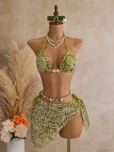 Three-piece olive green bikini set with white floral embroidery shown on a mannequin.