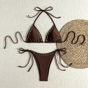 Sexy two-piece chocolate brown bikini set with silver rivet details and halter tie-neck style