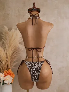 Back view showing the fit and abstract white pattern detail of the brown bikini set