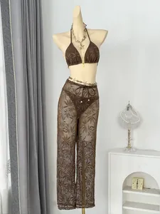 Detailed view of the leaf pattern lace on 3-piece brown bikini set with pants