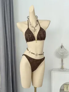 Detailed macro view of the brown leaf pattern crochet bikini set on a female mannequin
