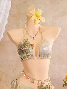 Detail of metallic 3-piece bikini featuring intricate floral embroidery and sequins.