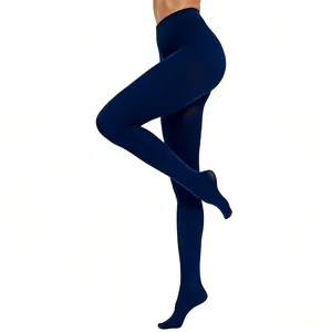 Side view of elegant dark navy blue 100D velvet footed tights on a female model