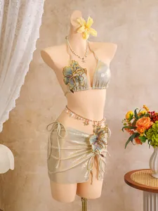 Metallic gold three-piece bikini set with 3D floral embroidery and matching mini skirt