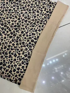Detailed view of fashionable leopard print leggings with a comfortable elastic waistband