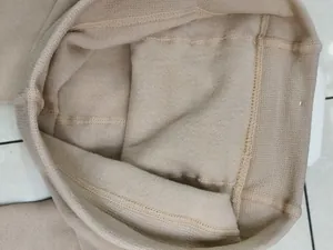 Detailed close-up view of soft beige fleece lining on winter thermal leggings for warmth.