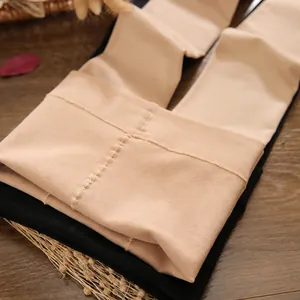 Close-up detail of thick fleece-lined winter leggings in natural skin tone and black