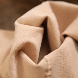 Close-up view of the soft and warm thin fleece lining of nude effect winter leggings.