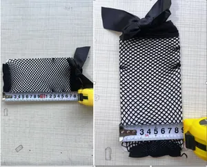Detailed measurement view of black fishnet socks with a large bow for Lolita style
