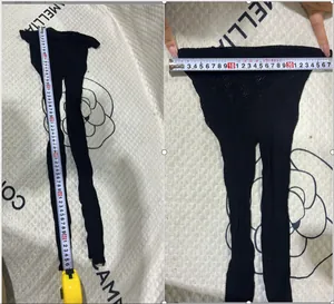 Detailed measurement showing the length and waist width of girls' black mesh pantyhose