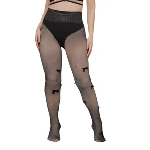 Sheer black pantyhose featuring velvet bows and pearl embellishments for a vintage look.