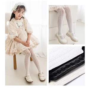 Close-up of heart pattern jacquard mesh tights for girls in white, black and cream