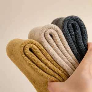 Thick thermal knitted cotton crew socks for winter warmth shown in three neutral colors