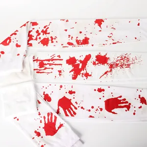 Close-up detail of white Halloween stockings featuring realistic red blood splatter and handprints