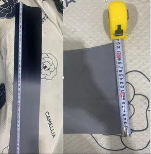 Detailed view showing the length and width measurements of the oil shiny body bag