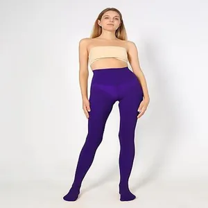 Full length studio shot of opaque purple velvet tights on a female model with white background