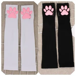 Kawaii black and white over the knee socks featuring 3D pink silicone cat paw pads