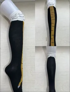 Detail views of funny chicken leg novelty knee-high socks with unique leg patterns.