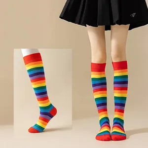 High quality detailed view of vibrant rainbow striped over-the-knee socks for women dance wear