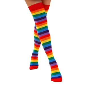 Macro view of vibrant rainbow striped over-the-knee high socks for women and girls