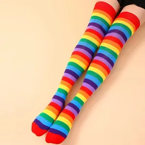 Detail view of vibrant rainbow striped over-the-knee cotton socks with soft knit texture