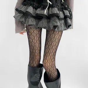 Detailed close-up view of black hollow lace stockings with sexy diamond grid pattern