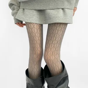 Close-up of grey diamond patterned lace stockings with a delicate hollow-out mesh