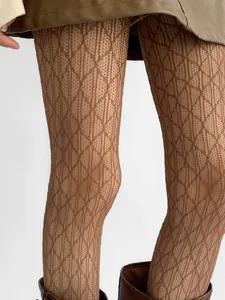 Close-up macro shot showing texture of brown diamond pattern lace hollow stockings