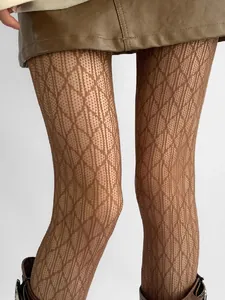 Detailed view of brown hollow lace tights with an intricate diamond pattern texture.