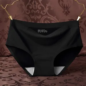 Seamless ice silk panties for women in black hanging on hanger