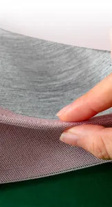 Detailed close-up of seamless bra edge showing breathable pink mesh and grey fabric lining