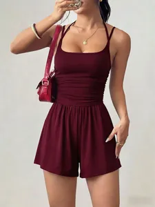 Close-up detail of burgundy summer romper featuring ruched bodice and wide-leg shorts