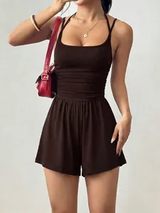 Close-up of summer brown sleeveless romper featuring cinched waist detail and wide-leg shorts